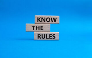 Know the rule symbol. Wooden blocks with words Know the rules. Beautiful blue background. Business and Know the rules concept. Copy space.