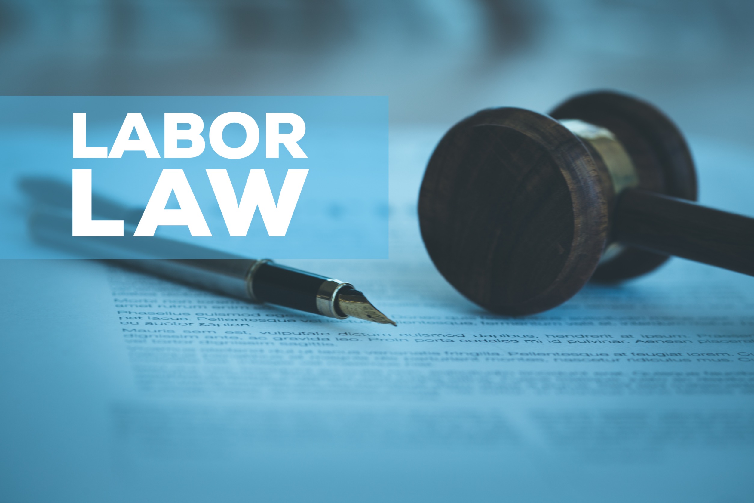 rule labor law text with gavel and fountain pen on contract paper